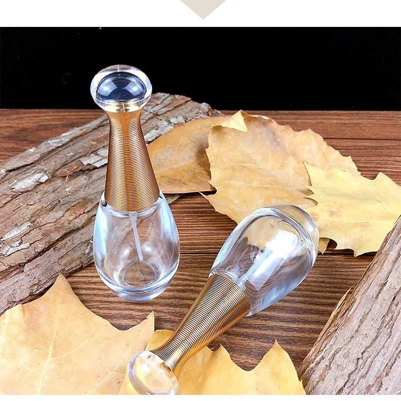 Sunshine Personalized Luxury High-grade Gold Transparent Wholesale Empty Cosmetic Packaging Container 30ml Perfume Glass Bottle